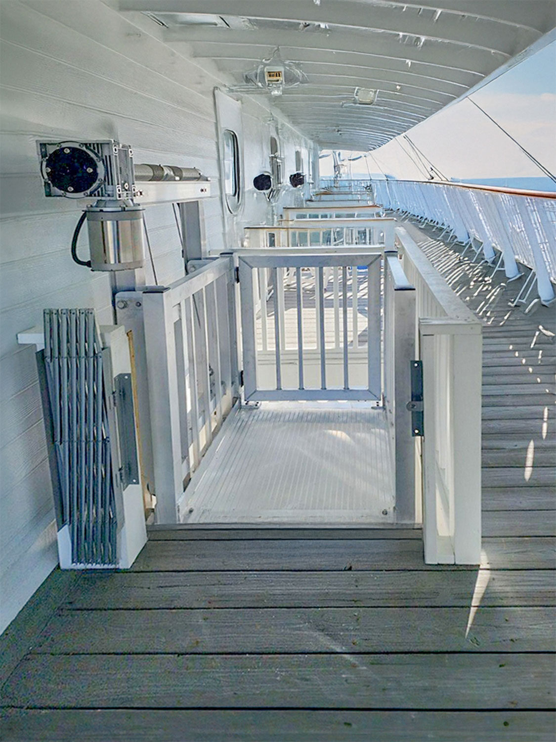 Galaxy Shuttle cargo lift on a white boardwalk structure overlooking the water