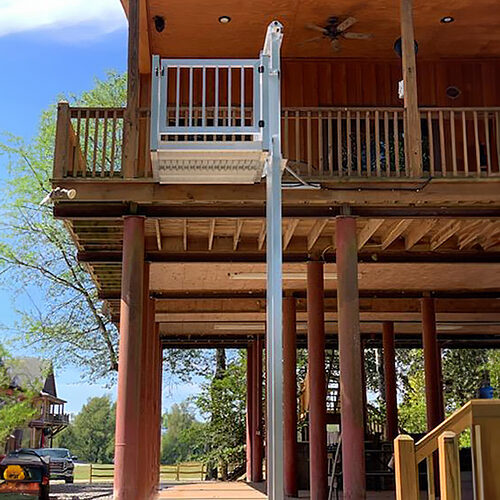 Galaxy Shuttle+ cargo lift installed on a wood-toned stilt house