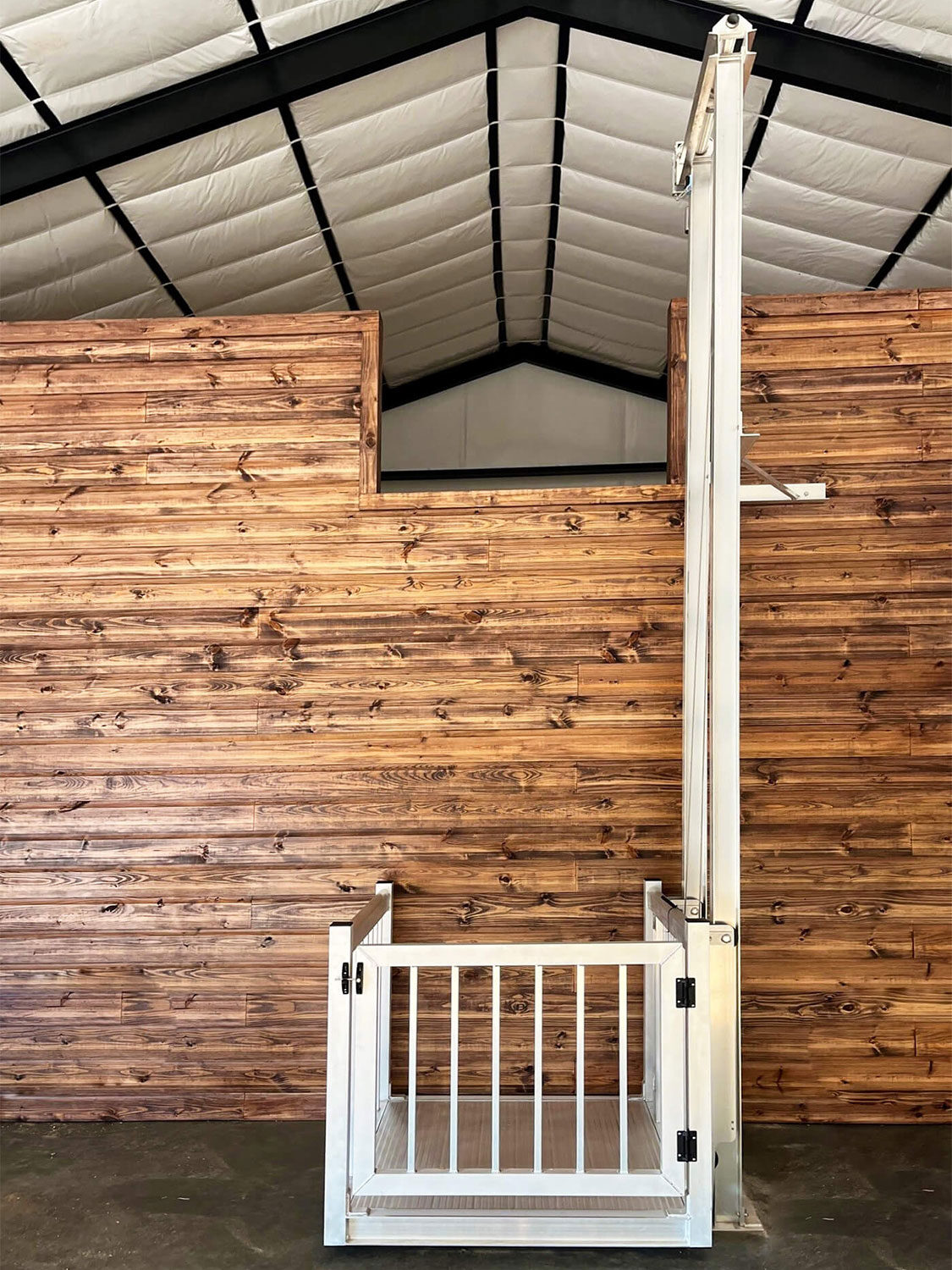 Galaxy Voyager HD cargo lift in a finished barn interior with dark wood paneling