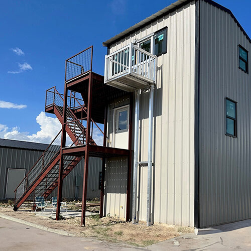 Galaxy Voyager+ three-stop cargo lift on a tan metal commercial building